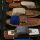 Boats protected with canvas covers beside a wooden dock